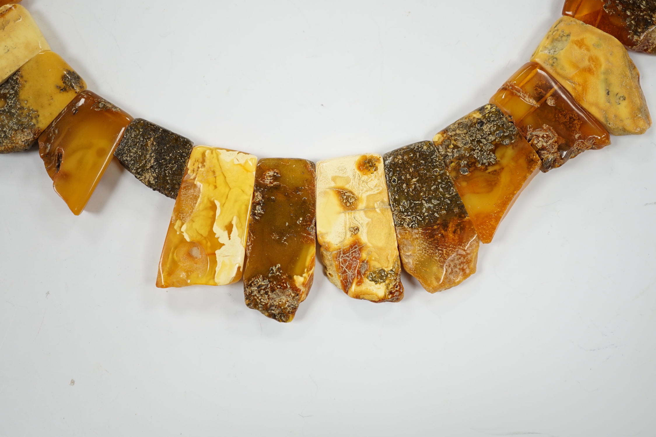 A contemporary Baltic amber fringe necklace, 46cm, gross weight 72 grams.